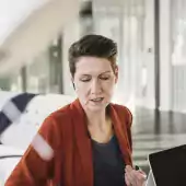 General man and woman with laptop