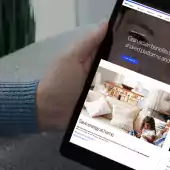 Person viewing a tablet of their bill