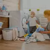Mother and child doing laundry