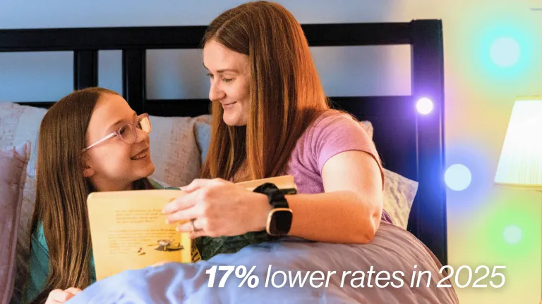 A mother and daughter sitting in bed reading a book together, with text overlay stating 17% lower rates in 2025.