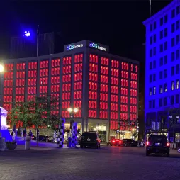 window lights on aes indiana building colored red